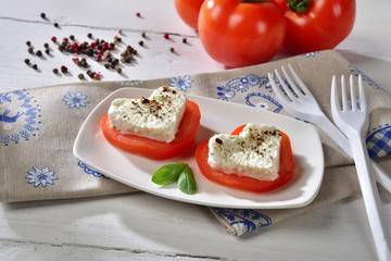 Caprese with buffalo mozzarella for Valentine's Day on to a towel to hearts