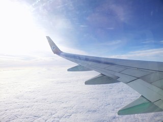 Obraz premium clouds and sky as seen through window of an aircraft