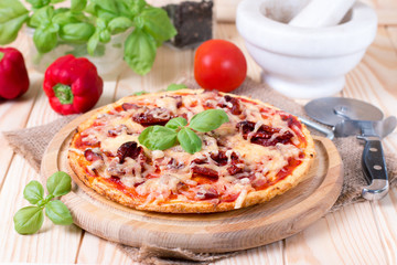 Fresh tasty pizza on wooden background