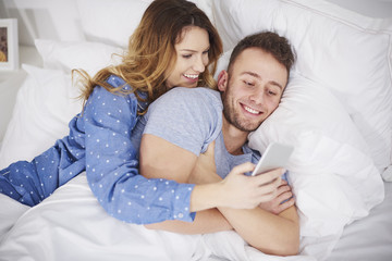 Picture of young couple with smartphone.