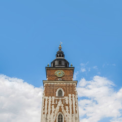 Fototapeta na wymiar Old Tower With Stylish Big Clock. Old Town Hall In City Center Of Krakow, Poland. Former City Hall.