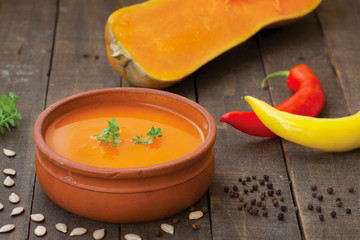 Traditional pumpkin soup with seeds and black pepper
