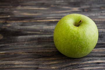 Apples on a wooden background in rustic style