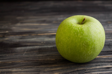 Apples on a wooden background in rustic style