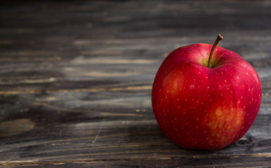 Apples on a wooden background in rustic style