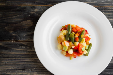 Vegetable salad on a white plate. Dietary dish.