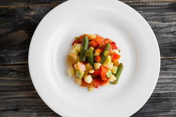 Vegetable salad on a white plate. Dietary dish.