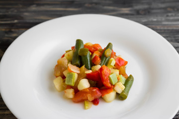Vegetable salad on a white plate. Dietary dish.