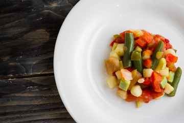 Vegetable salad on a white plate. Dietary dish.