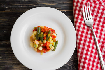 Vegetable salad on a white plate. Dietary dish.