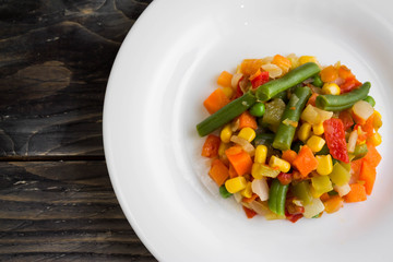 Vegetable salad on a white plate. Dietary dish.