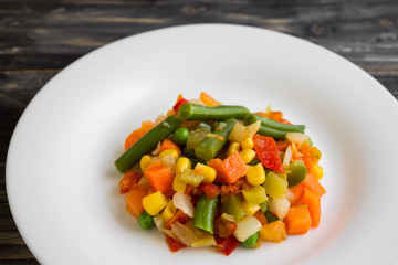 Vegetable salad on a white plate. Dietary dish.