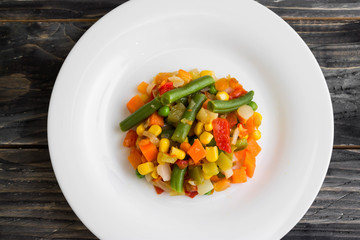 Vegetable salad on a white plate. Dietary dish.