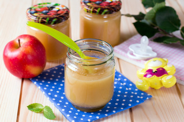 Jar with apple of baby food