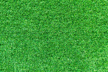 Obraz premium Green grass texture, grass background for design with copy space for text or image. Top view of artificial green grass for golf course and soccer field.