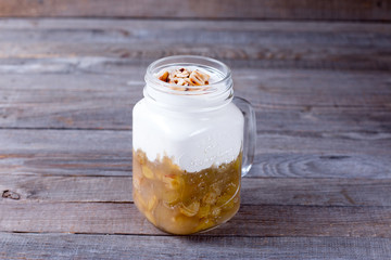 Fresh homemade yogurt in a glass jar