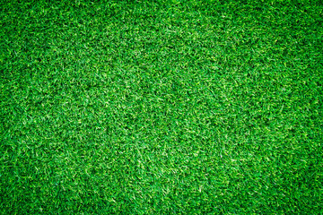Fototapeta premium Green grass texture, grass background for design with copy space for text or image. Top view of artificial green grass for golf course and soccer field.