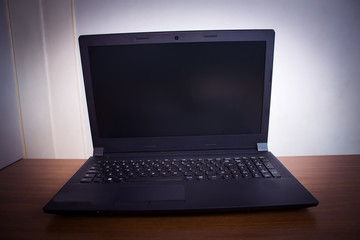 black laptop on table