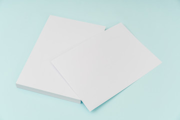 Blank flyer poster, brochure mockup,A4, US-Letter, on blue backg