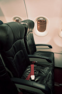 Airplane seats in the cabin ( Filtered image processed vintage e