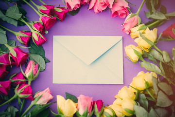 beautiful yellow and pink rose flowers and envelope