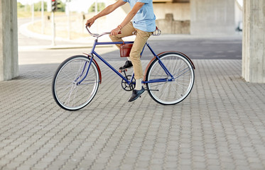 Fototapeta premium hipster man riding fixed gear bike