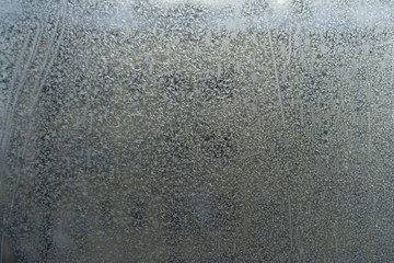 frozen glass on the window in winter