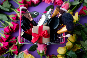 rose flowers and shopping basket with cosmetics