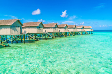 Beautiful water villas in tropical Maldives island  .