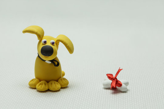 Dog a mongrel and a bone from plasticine