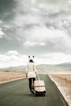 Girl traveling through the road