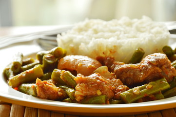spicy stir fried fat pork and yard long bean curry eat couple with rice