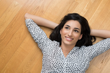 Thinking woman on floor