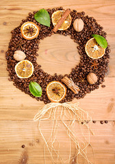 Fototapeta na wymiar Coffee background. Heap roasted coffee beans in shape of wreath