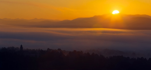 Misty dawn over  mountains