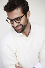 Guy in glasses and white sweater, smiling