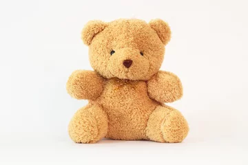 Fotobehang Brown teddy bear on a white background. © Vichit