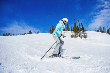 Fototapeta na wymiar young girl skiing in the mountains Sheregesh