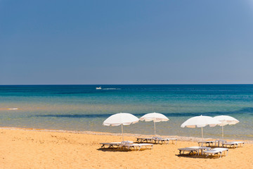 Beach with sun loungers