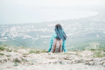 Backpacker resting on mountain
