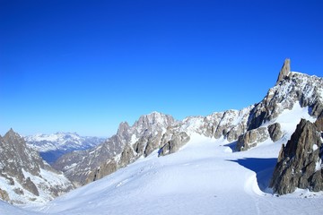 Naklejka na ściany i meble Winter landscape in Mont Blanc massif with Dente del Gigante peak