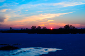 Beautiful winter sunset on river Dnieper