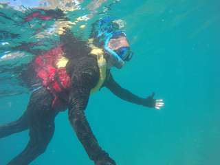 Underwater scuba diving selfie in Great Barrier Reef, Australia