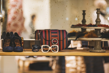 sun glasses and purses in a luxury store