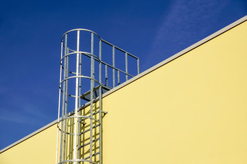 stair for fire escape with the steel wall of the factory building