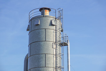 Detail of chemical plant, silos and pipes