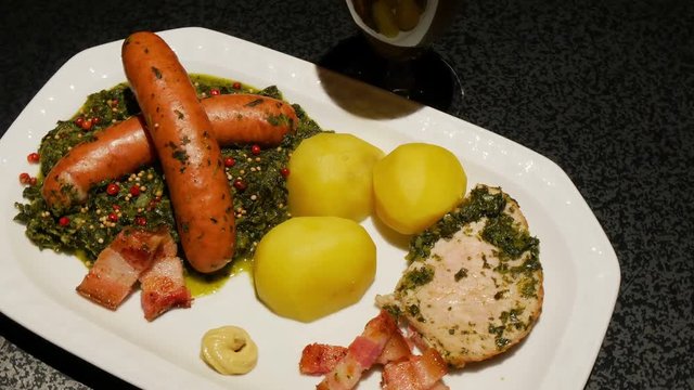 Kale with mette ends and kassler chops rotating - green cabbage 4k 11848
