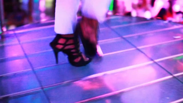 Legs of PJ girl, dancing at the nightclub