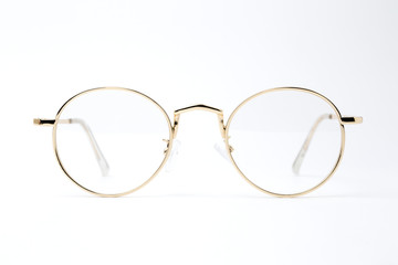 classic gold round glasses on white background