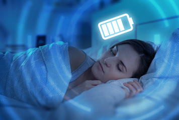 Woman sleeping and charging battery, health concept
